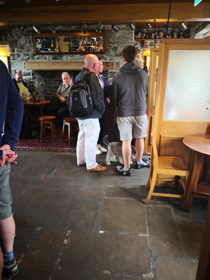 PEOPLE IN SHORTS STANDING&nbsp;AROUND